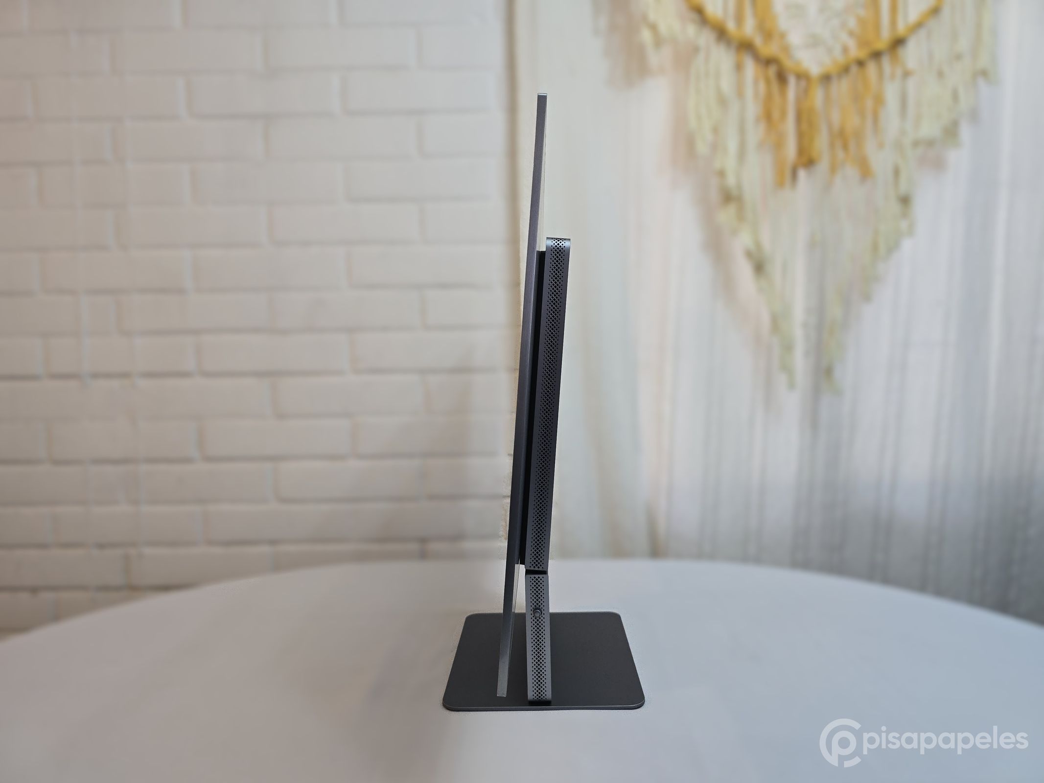TCL 32X3A OLED+ - Pisapapeles foto 47