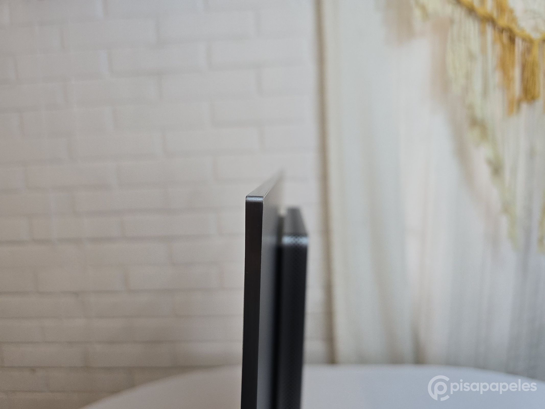 TCL 32X3A OLED+ - Pisapapeles foto 54